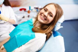 Woman smiling after her cosmetic dental treatment